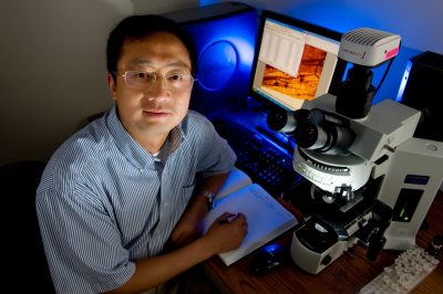 Shuhai Xiao with microscope